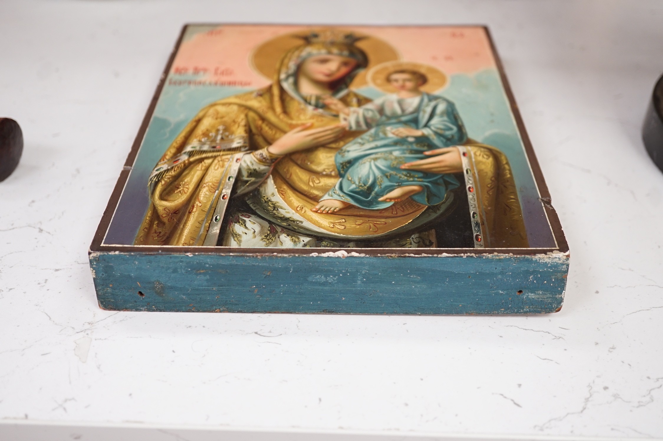 A Russian painted wood icon of Virgin and child, 22.5x18cm